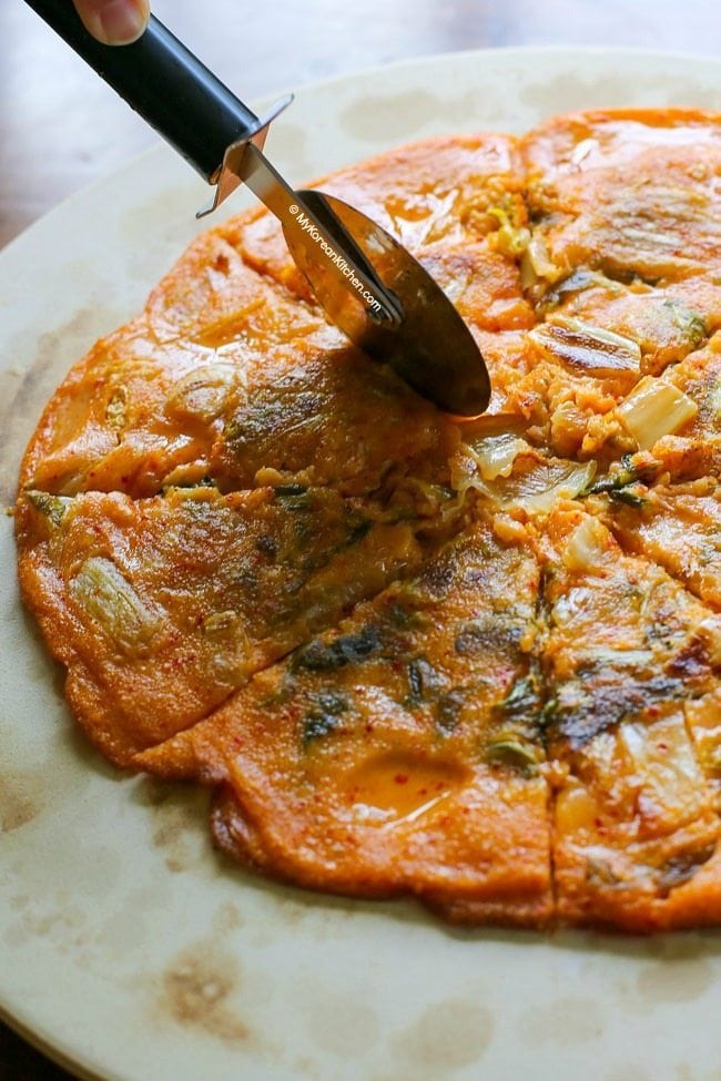 Kimchi Jeon Pancakes being cut