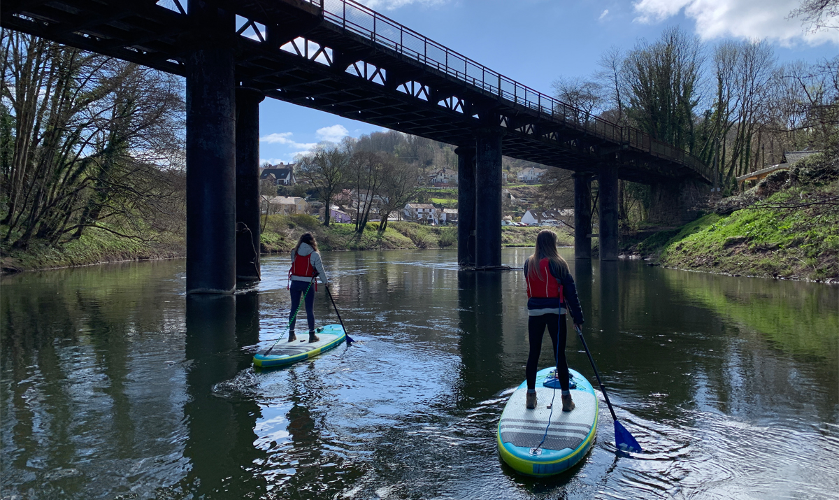 AdAstra Paddleboarding under a bridge